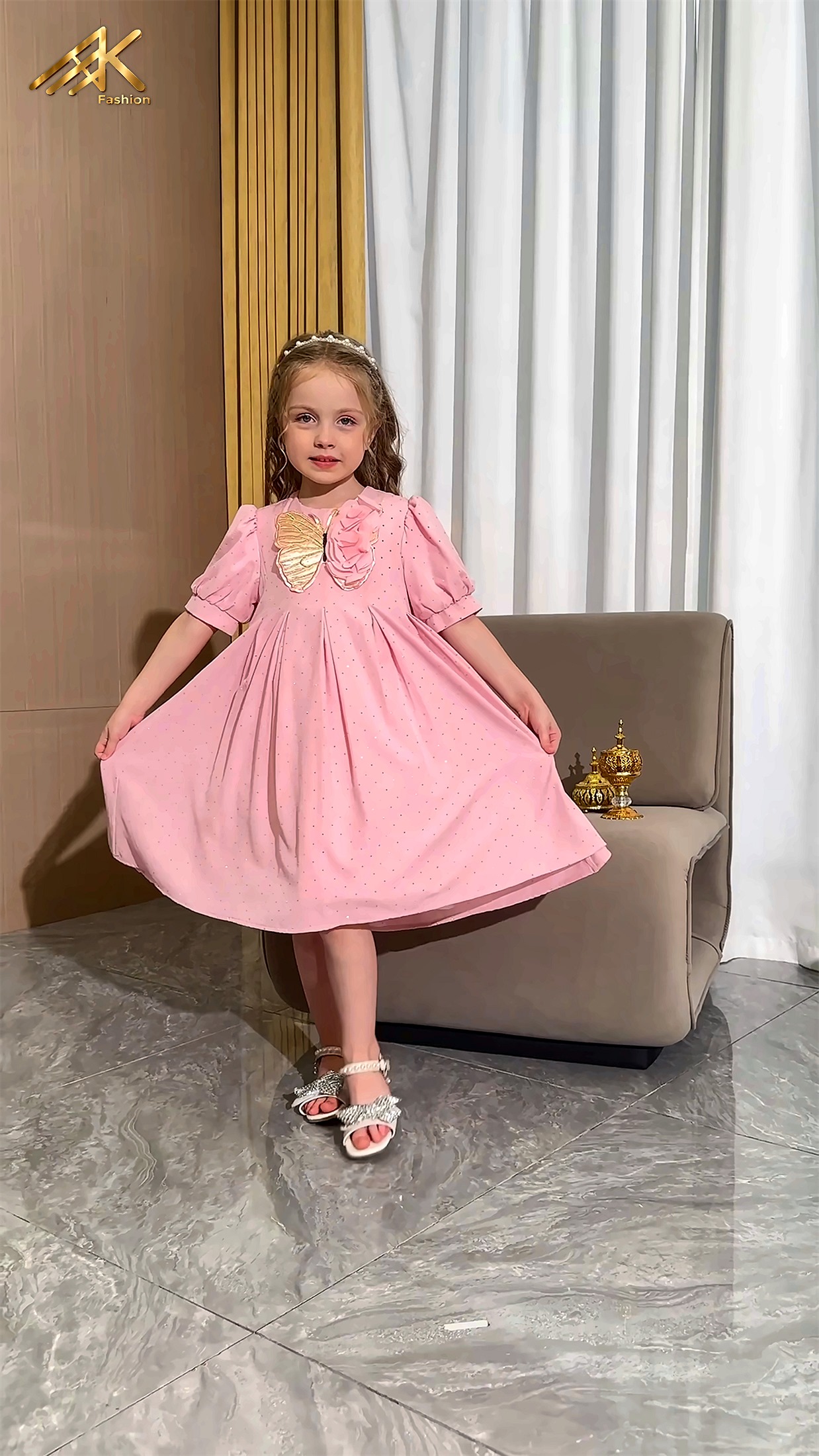 Pink dress with gold butterfly applique