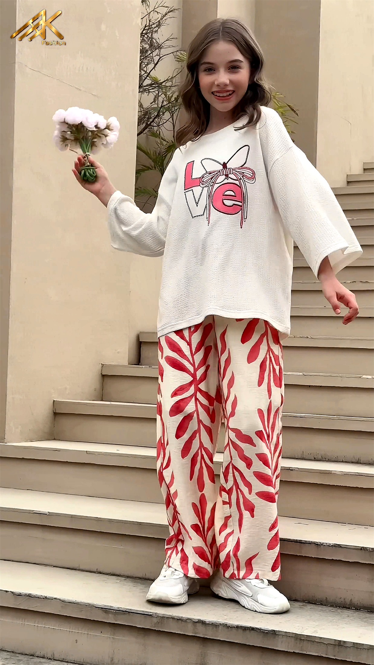 Cream LOVE graphic sweater with red leaf print trousers